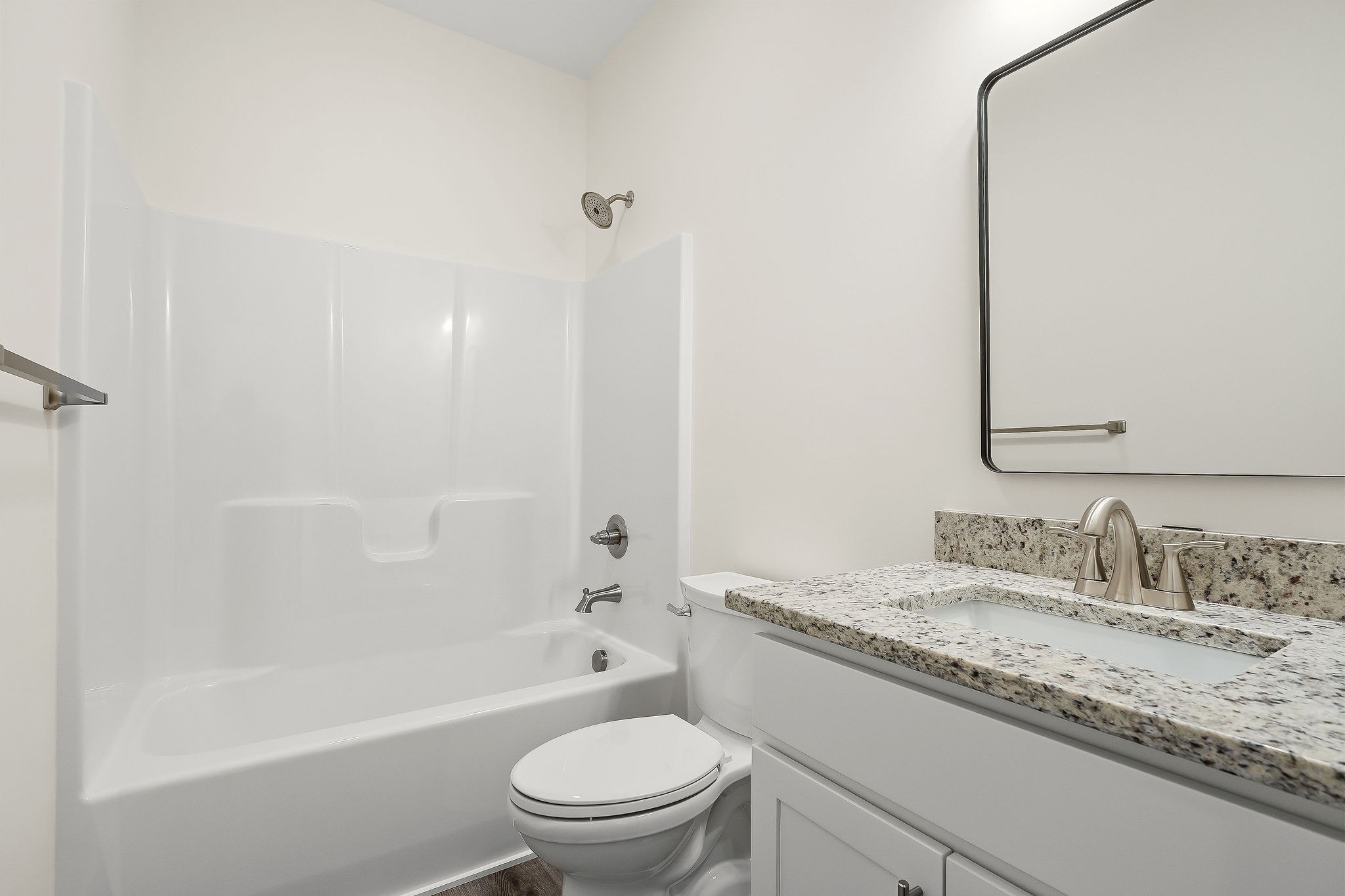 275 Johnson Chapel Road Sparta, TN 38583 - Photo 13 of 21 a bathroom with a granite countertop sink a toilet and bathtub