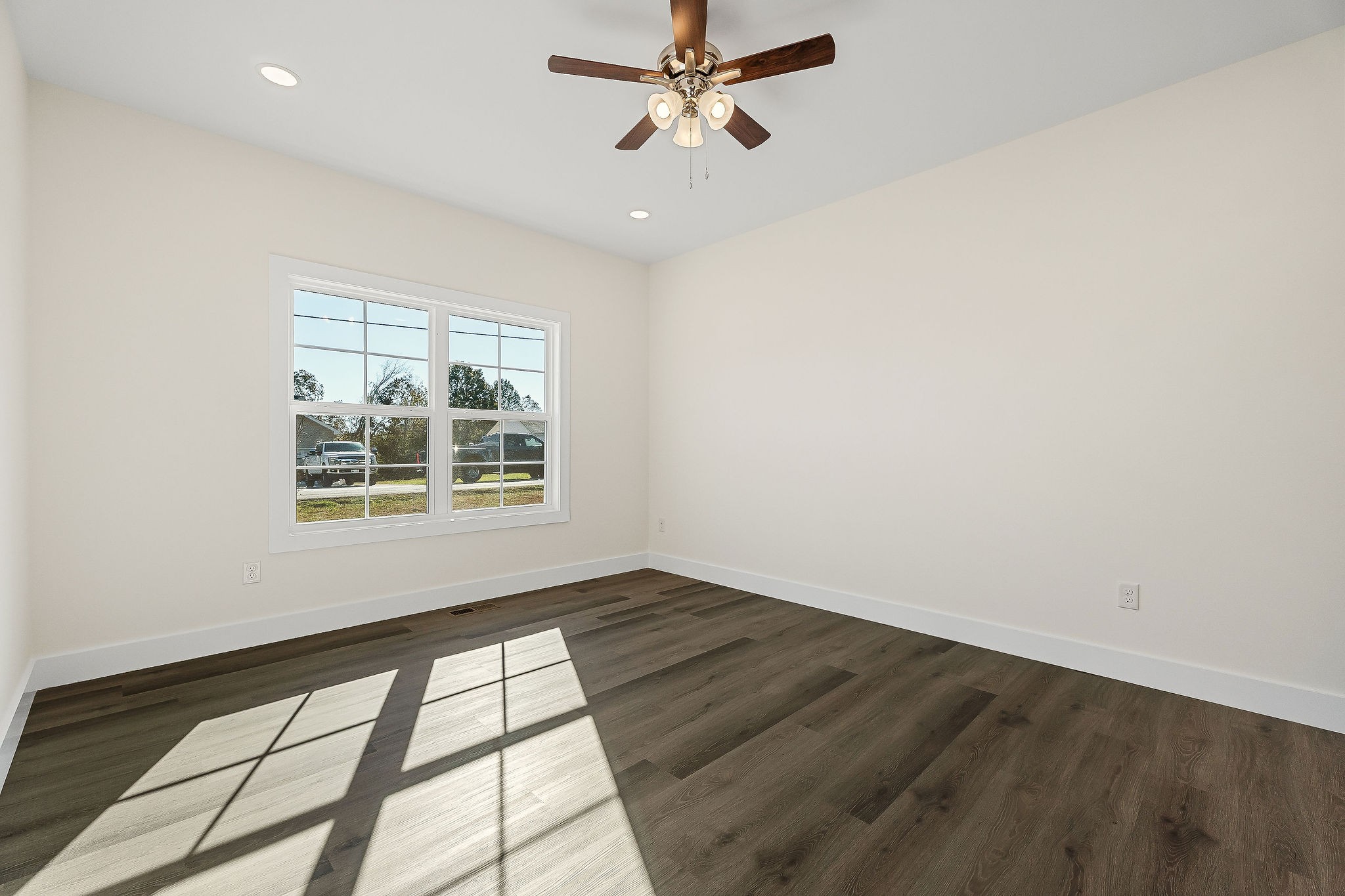 275 Johnson Chapel Road Sparta, TN 38583 - Photo 16 of 21 an empty room with wooden floor fan and windows