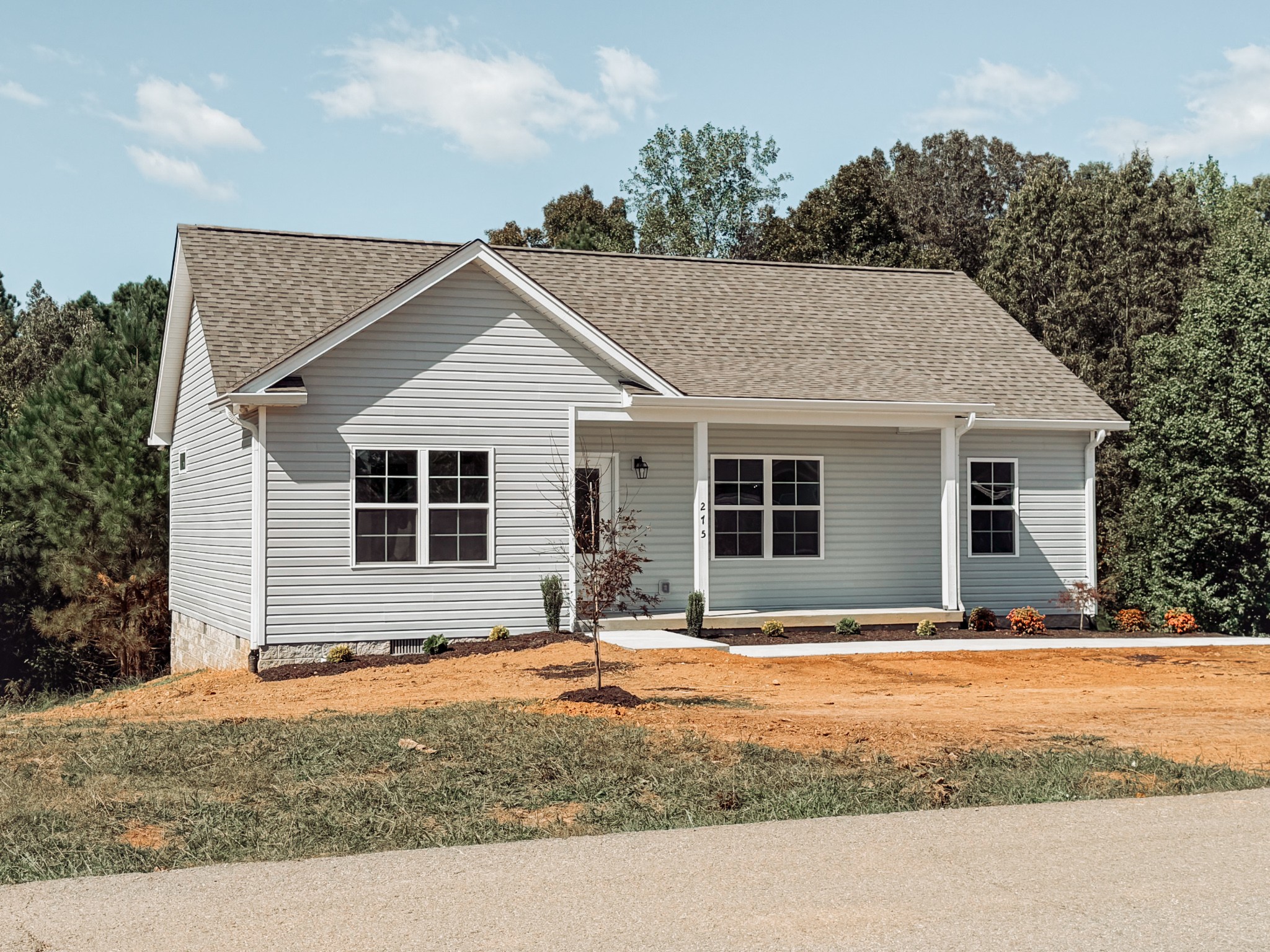 275 Johnson Chapel Road Sparta, TN 38583 - Photo 3 of 21 a front view of a house with yard and trees in the background