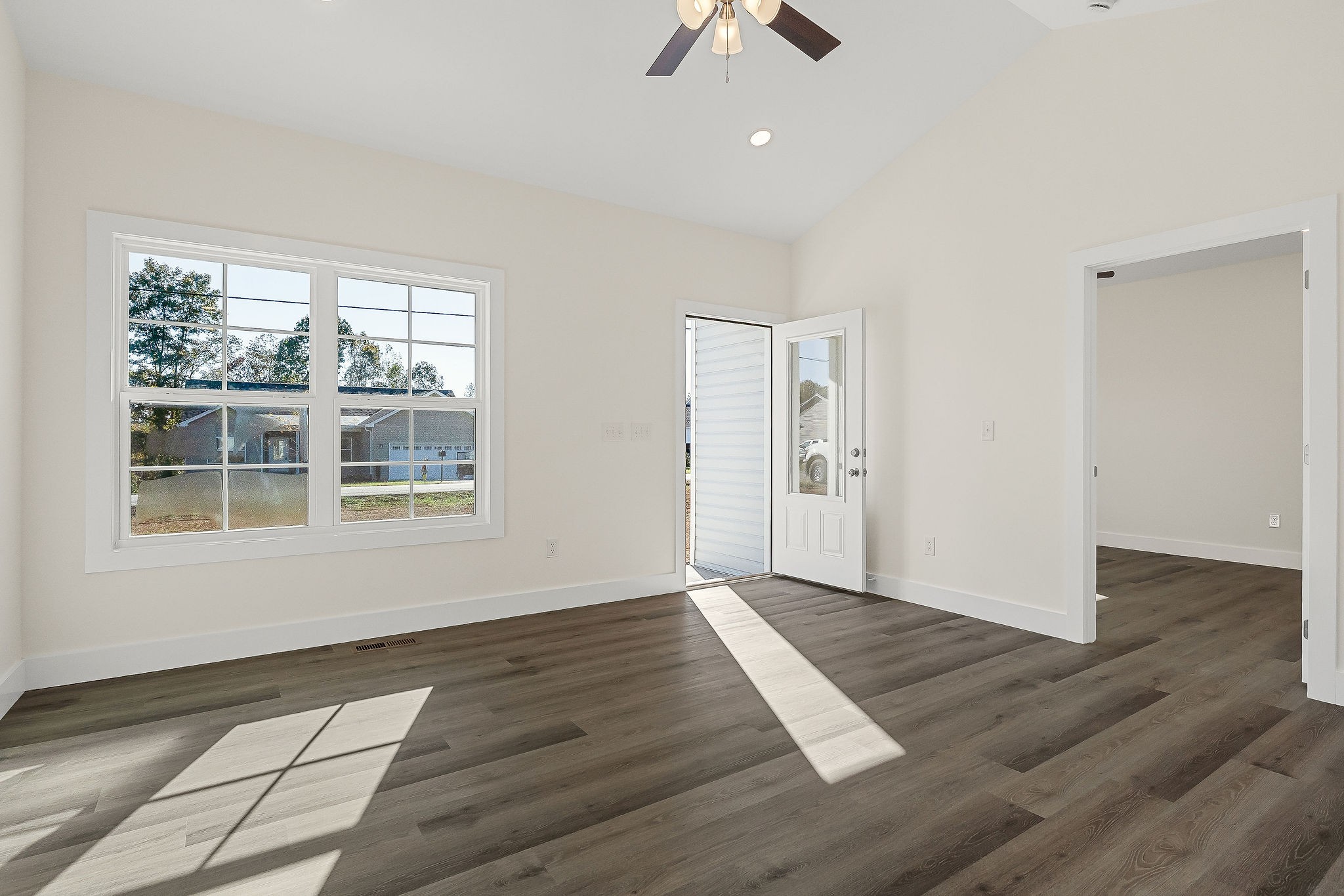 275 Johnson Chapel Road Sparta, TN 38583 - Photo 6 of 21 an empty room with wooden floor cabinet and windows