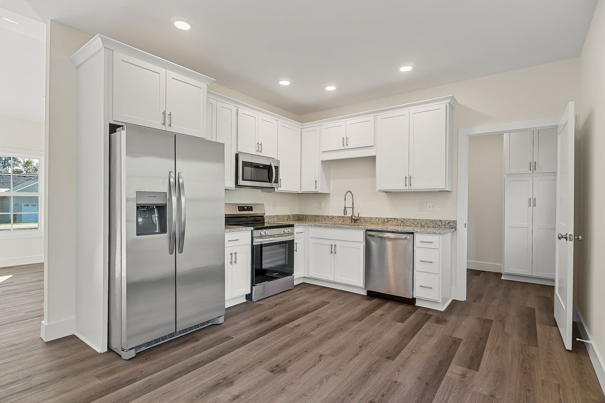275 Johnson Chapel Road Sparta, TN 38583 - Photo 8 of 21 a kitchen with a refrigerator cabinets and wooden floor