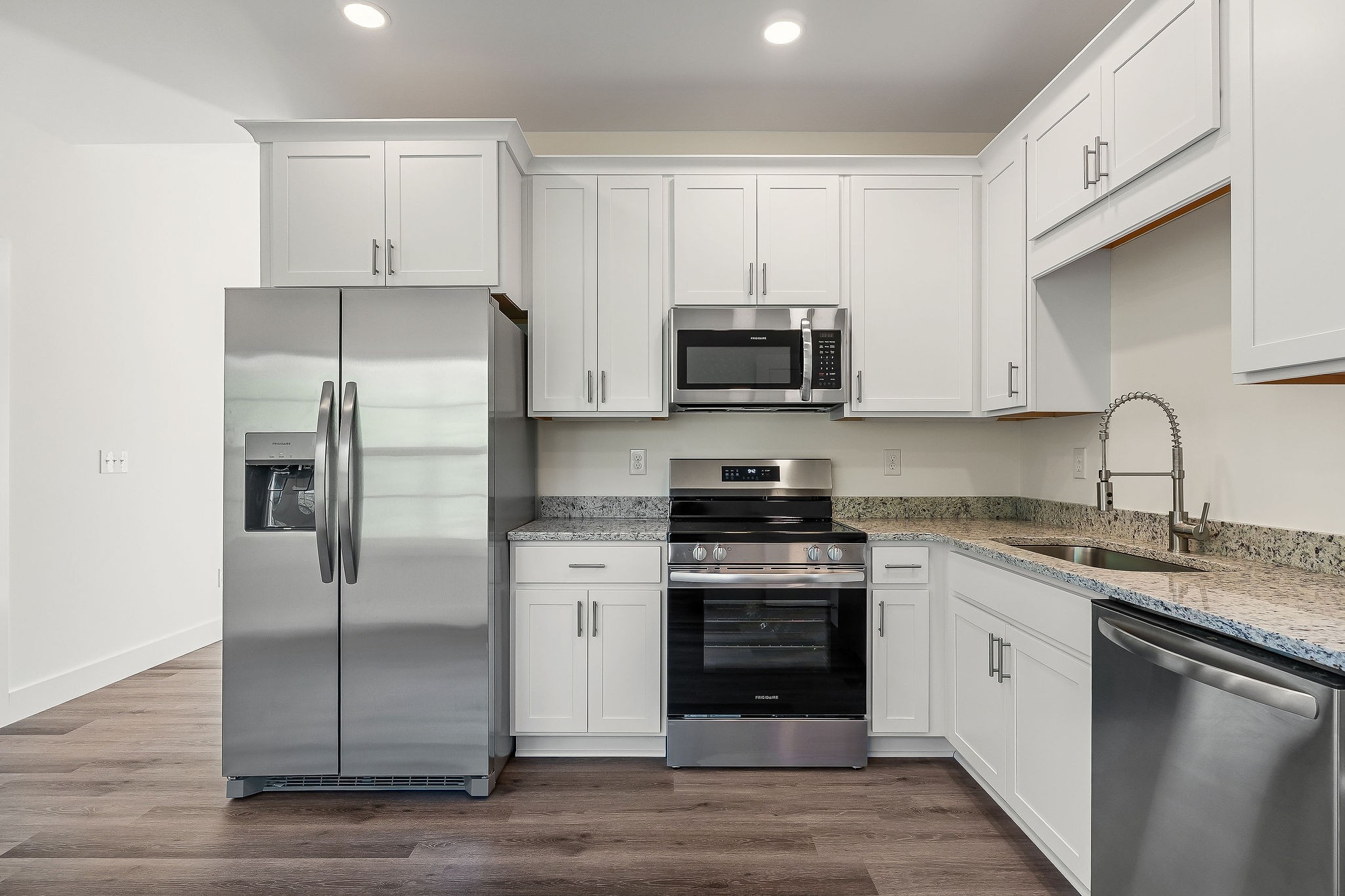 275 Johnson Chapel Road Sparta, TN 38583 - Photo 9 of 21 a kitchen with stainless steel appliances granite countertop a refrigerator stove and sink