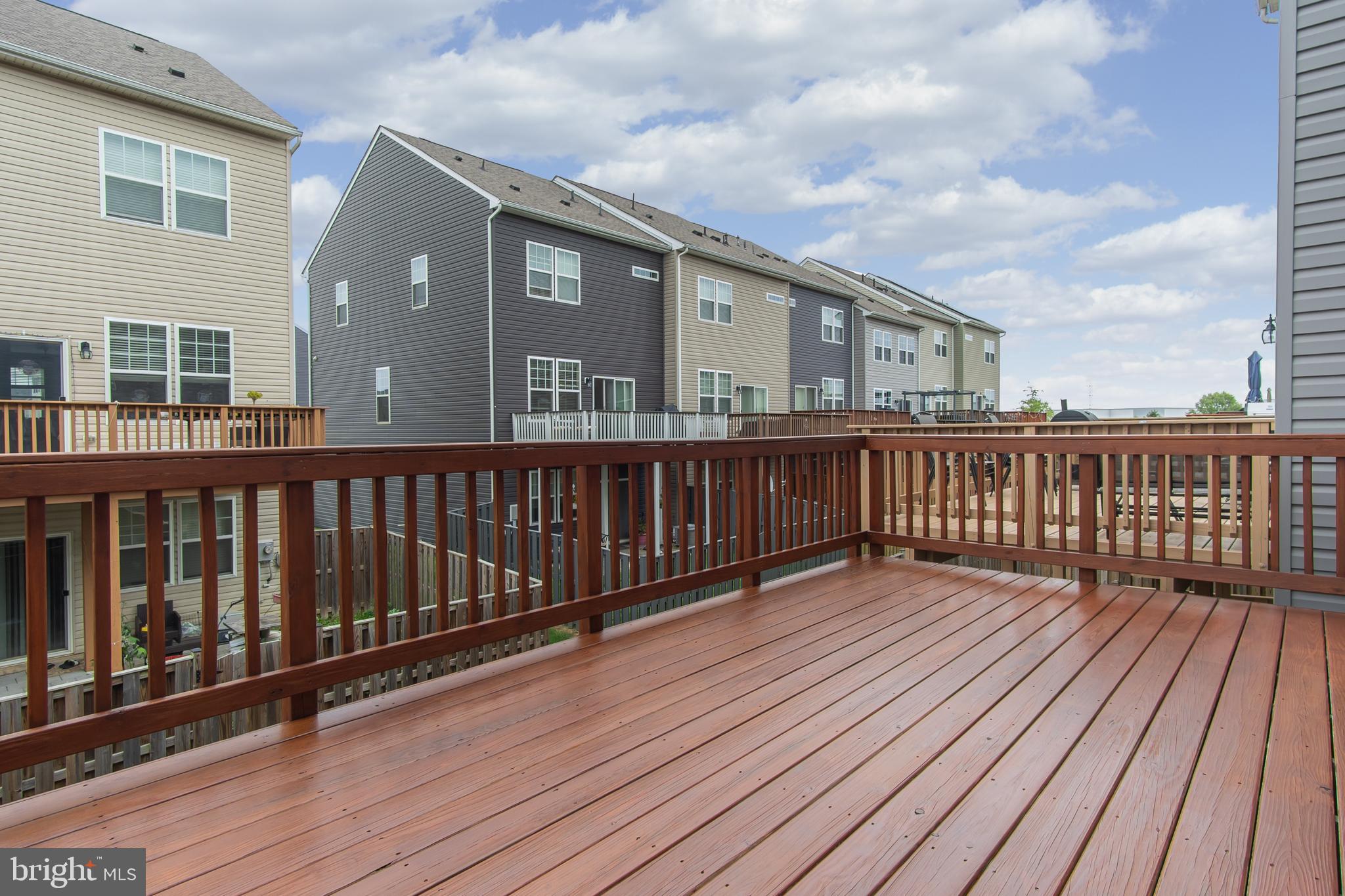 4615 Cambria Road Frederick, MD 21703 - Photo 25 of 33 a view of a wooden deck with large windows