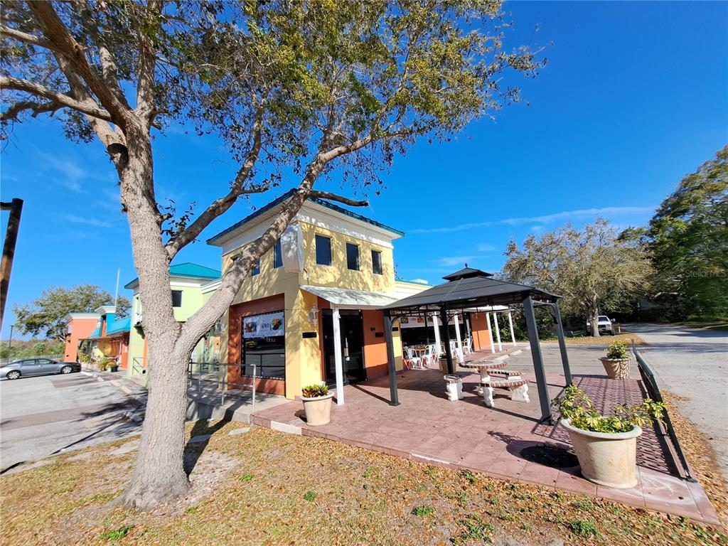 1600 Achieva Way Dunedin, FL 34698 - Photo 13 of 98 a front view of a building with sitting area