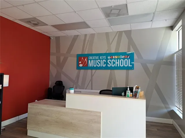 a living room with lots of furniture and white walls