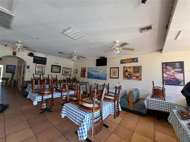 a living room with lots of furniture and a large window