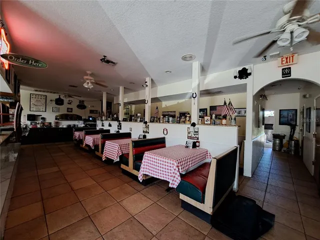 a room with gym equipment and view of living room