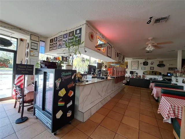 a kitchen with stainless steel appliances granite countertop a sink dishwasher stove and cabinets