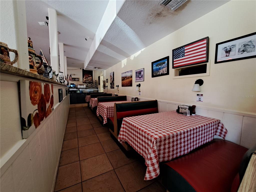 1600 Achieva Way Dunedin, FL 34698 - Photo 50 of 98 a bedroom with bed and a walk in closet