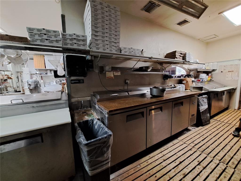 1600 Achieva Way Dunedin, FL 34698 - Photo 60 of 98 a kitchen with a sink and cabinets