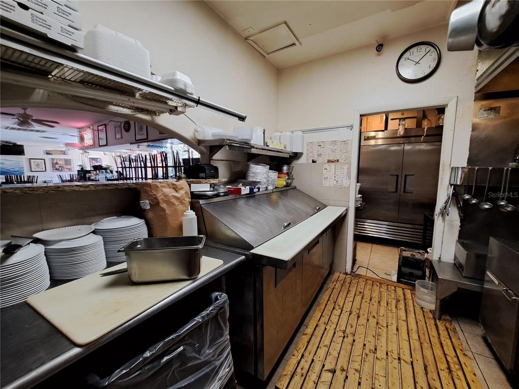 1600 Achieva Way Dunedin, FL 34698 - Photo 61 of 98 a kitchen with lots of counter top space and stainless steel appliances