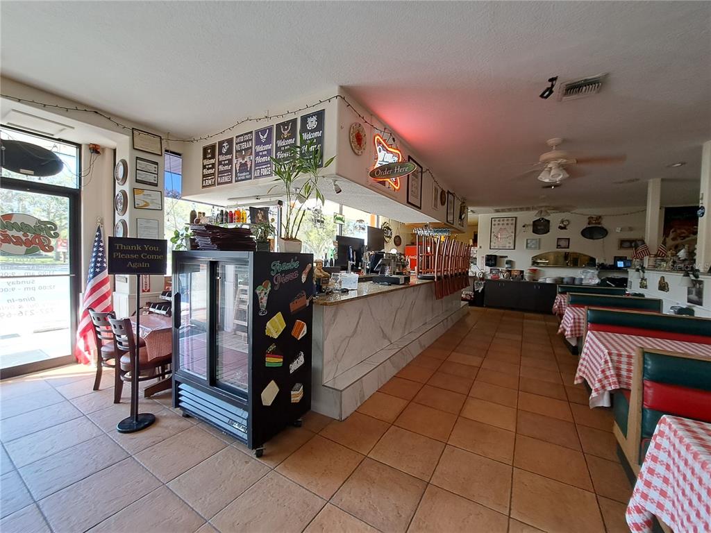 1600 Achieva Way Dunedin, FL 34698 - Photo 76 of 98 a living room with lots of furniture and appliances