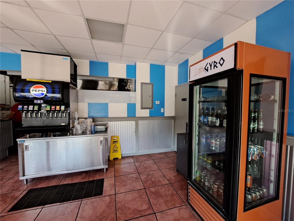 1600 Achieva Way Dunedin, FL 34698 - Photo 80 of 98 a kitchen with stainless steel appliances kitchen island granite countertop a refrigerator and a stove