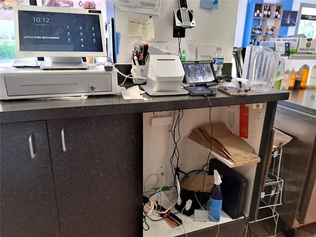 1600 Achieva Way Dunedin, FL 34698 - Photo 89 of 98 a living room with furniture and floor to ceiling windows