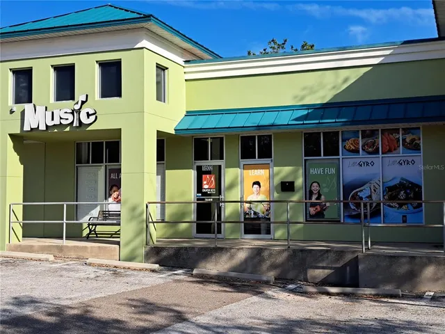 a view of a hallway with closet and a bathroom