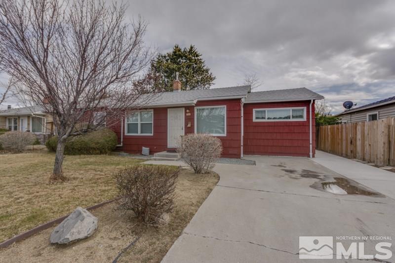 926 Wilkinson Avenue Reno, NV 89502 - Photo 1 of 1 a view of a house with a yard and garage