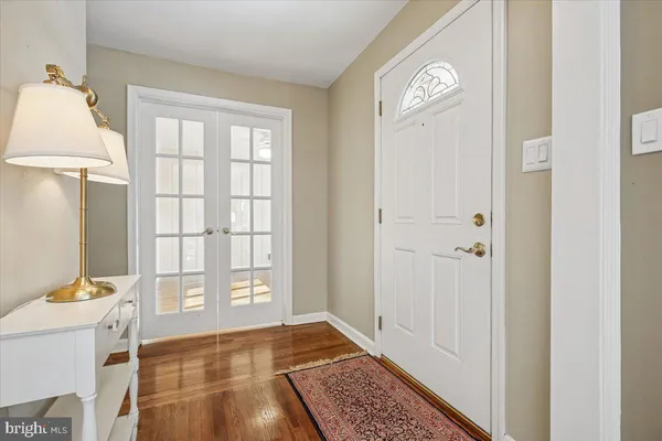 a view of an entryway with wooden floor