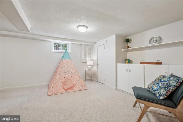 a kitchen that has a sink and a stove in it