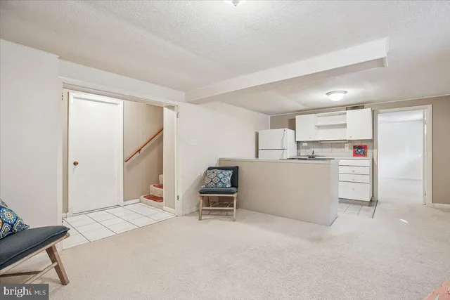 a kitchen with stainless steel appliances a refrigerator sink and cabinets