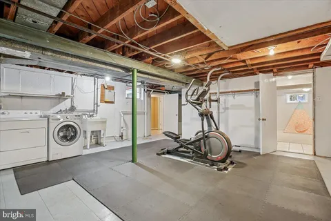 a view of a patio with table and chairs with wooden floor and fence