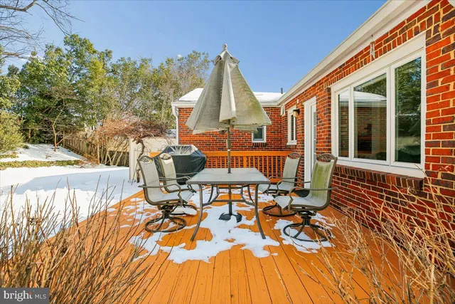 a view of a yard with snow on the road