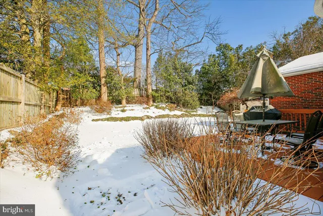 a picture of a bench in front of a wall