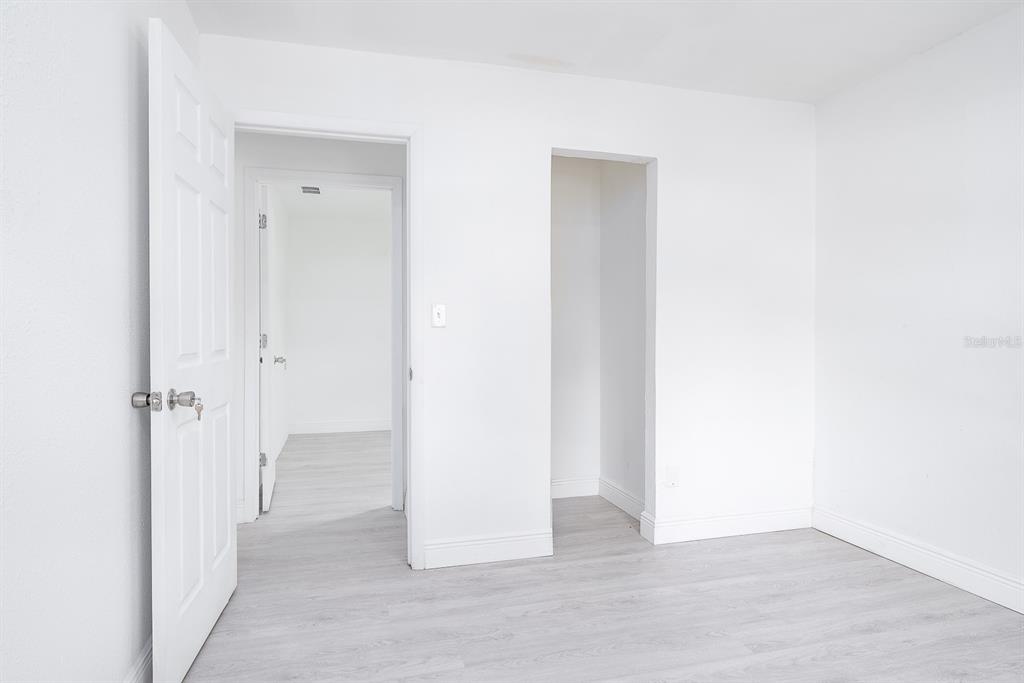 519 Williams Street Melbourne, FL 32901 - Photo 13 of 15 a view of a hallway with wooden floor