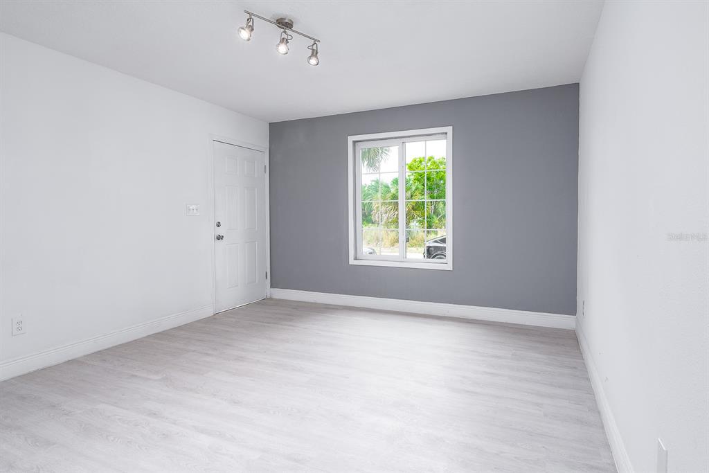 519 Williams Street Melbourne, FL 32901 - Photo 2 of 15 an empty room with windows