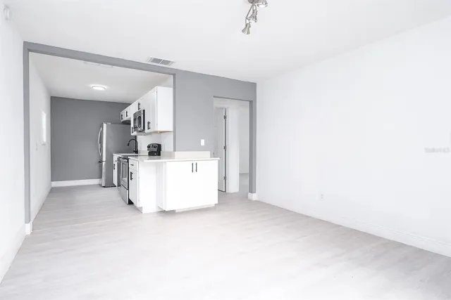 a view of a kitchen with a sink