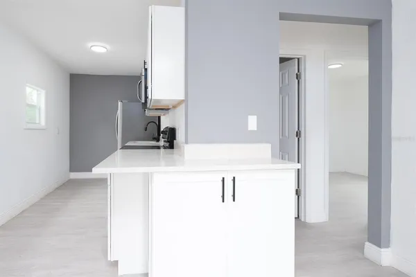 a bathroom with a sink vanity and a mirror
