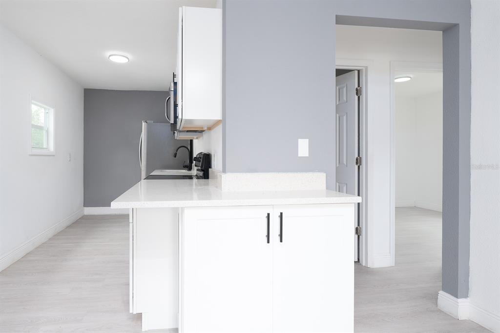 519 Williams Street Melbourne, FL 32901 - Photo 5 of 15 a bathroom with a sink vanity and a mirror