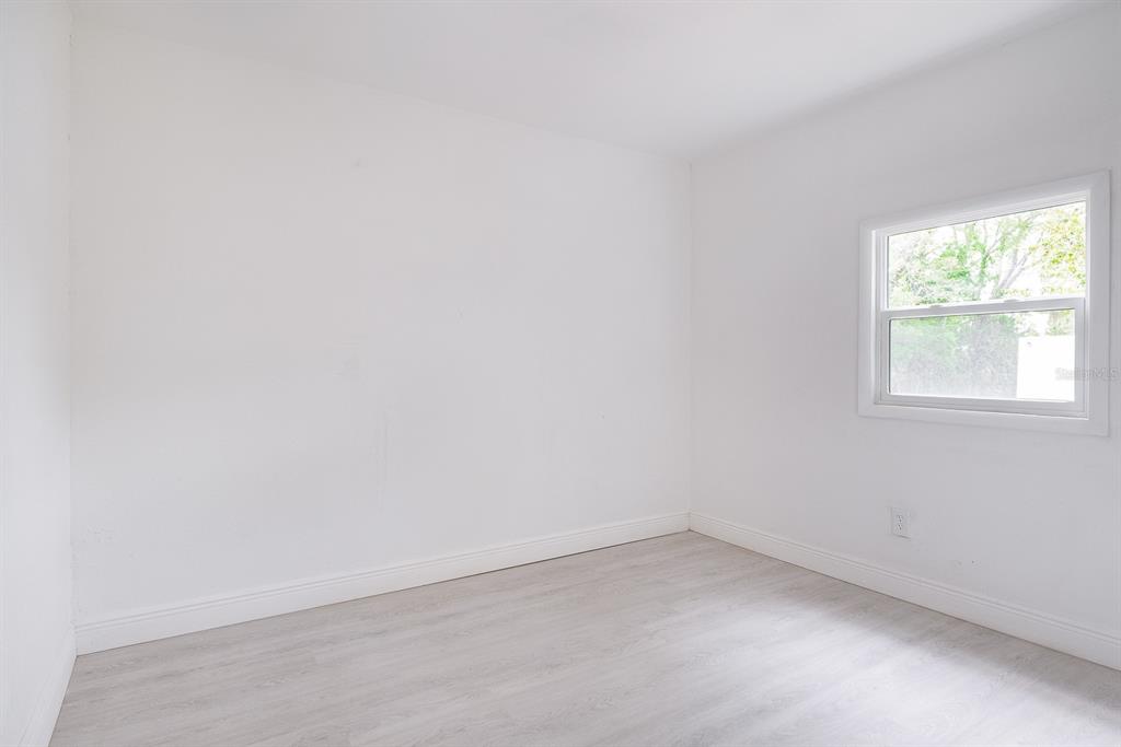 519 Williams Street Melbourne, FL 32901 - Photo 8 of 15 an empty room with a window