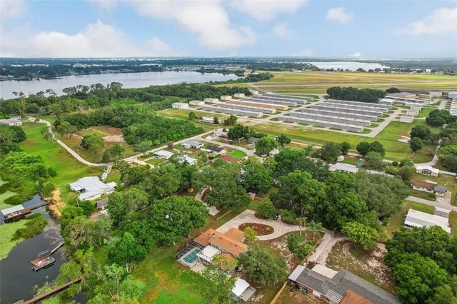a view of a lake with houses in the back