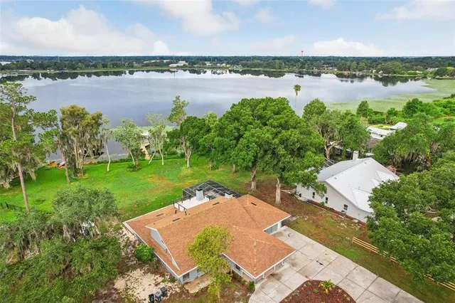 a large kitchen with a table and chairs in it