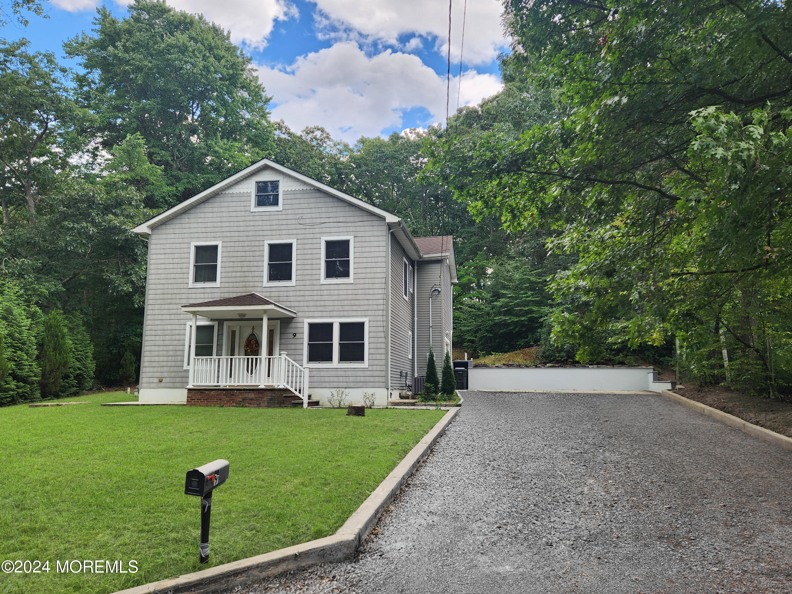 9 Francis Mills Road Freehold, NJ 07728 - Photo 2 of 39 a front view of a house with garden