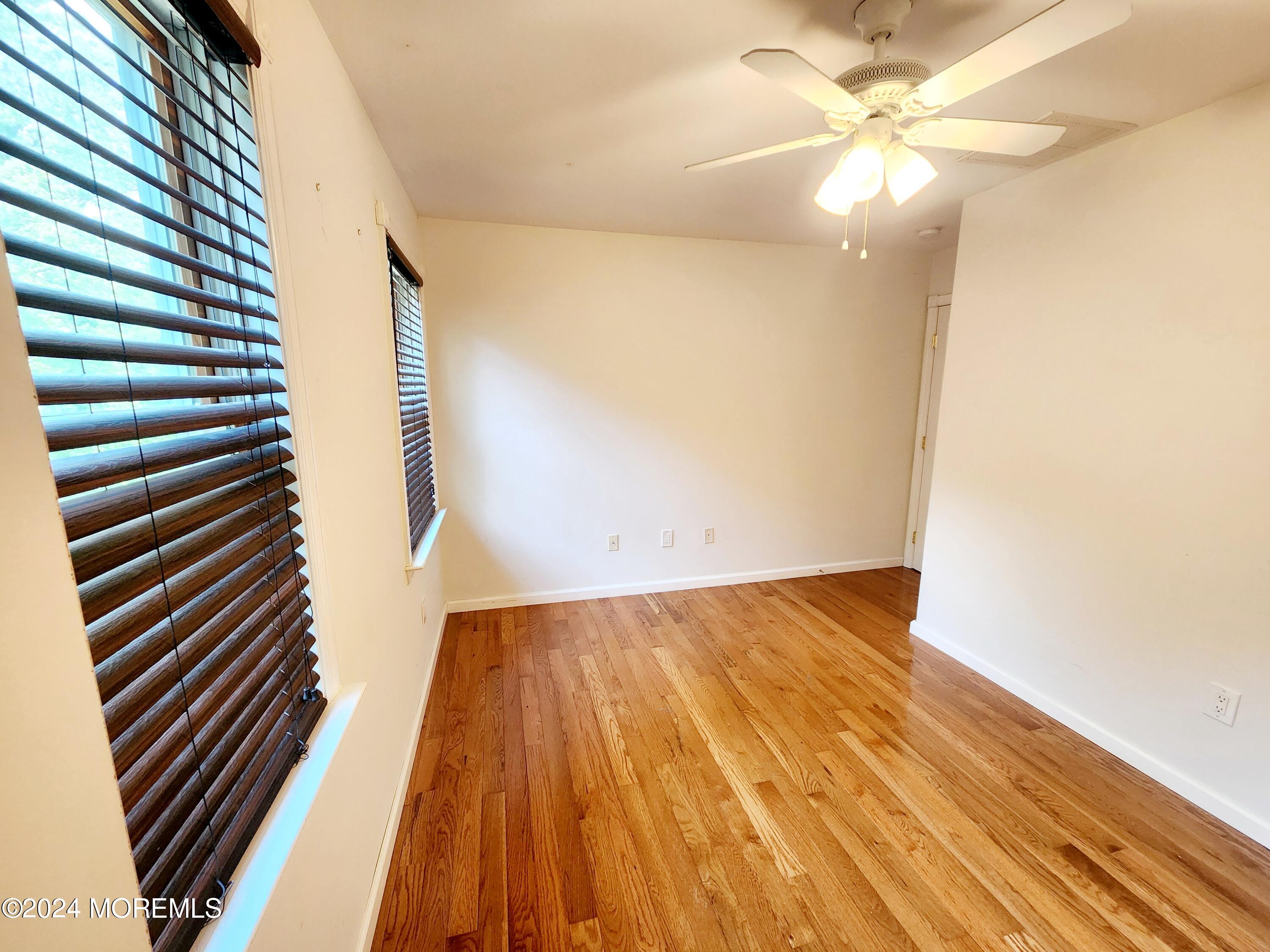 9 Francis Mills Road Freehold, NJ 07728 - Photo 27 of 39 a view of an empty room with wooden floor