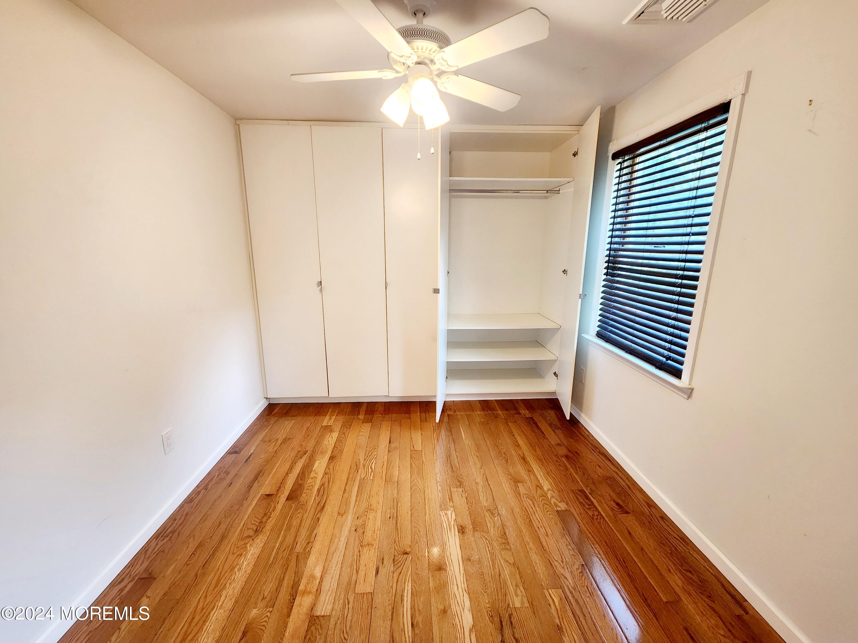 9 Francis Mills Road Freehold, NJ 07728 - Photo 28 of 39 a view of a room with wooden floors and ceiling fan