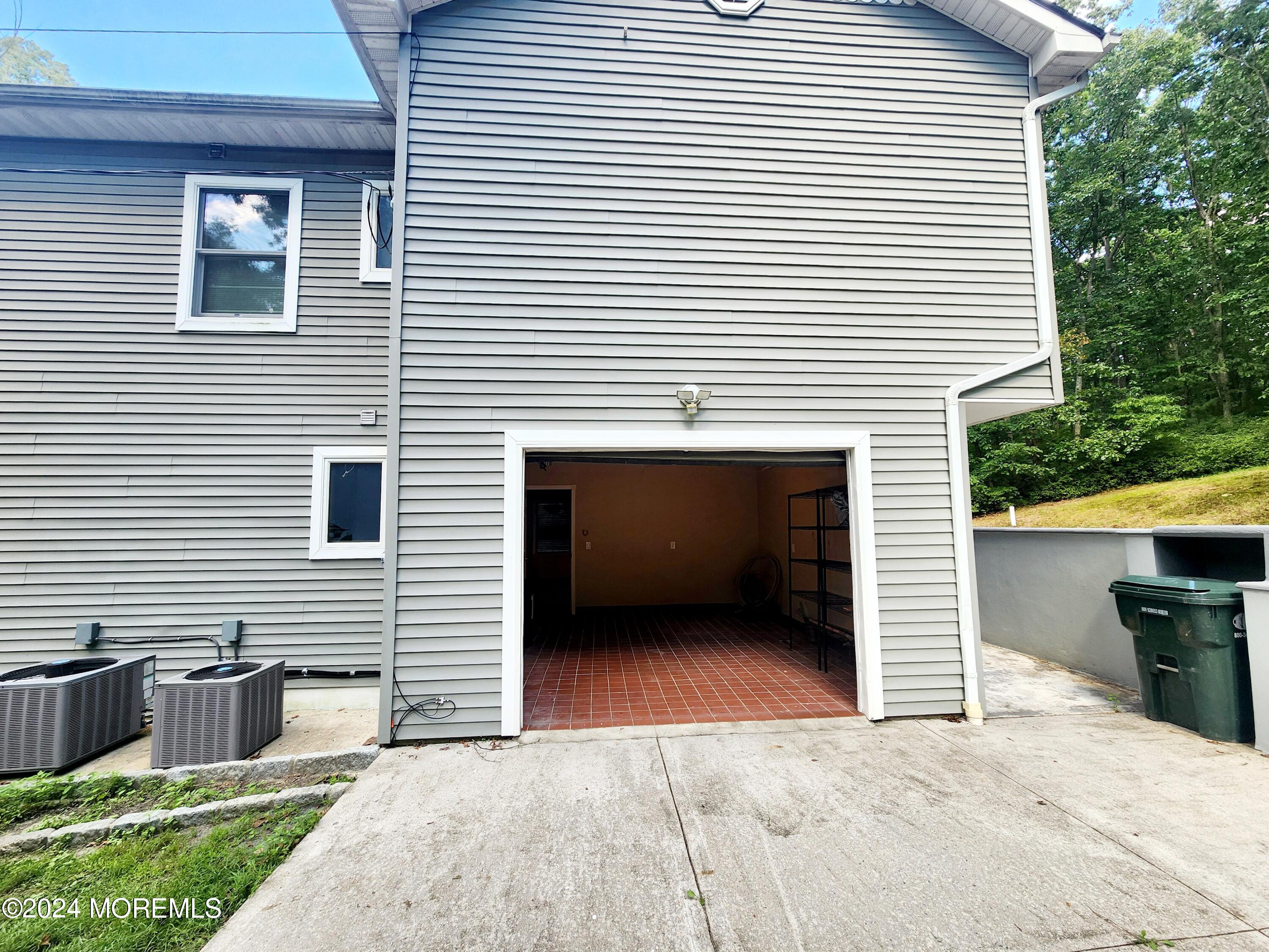 9 Francis Mills Road Freehold, NJ 07728 - Photo 34 of 39 a front view of a house with deck and yard
