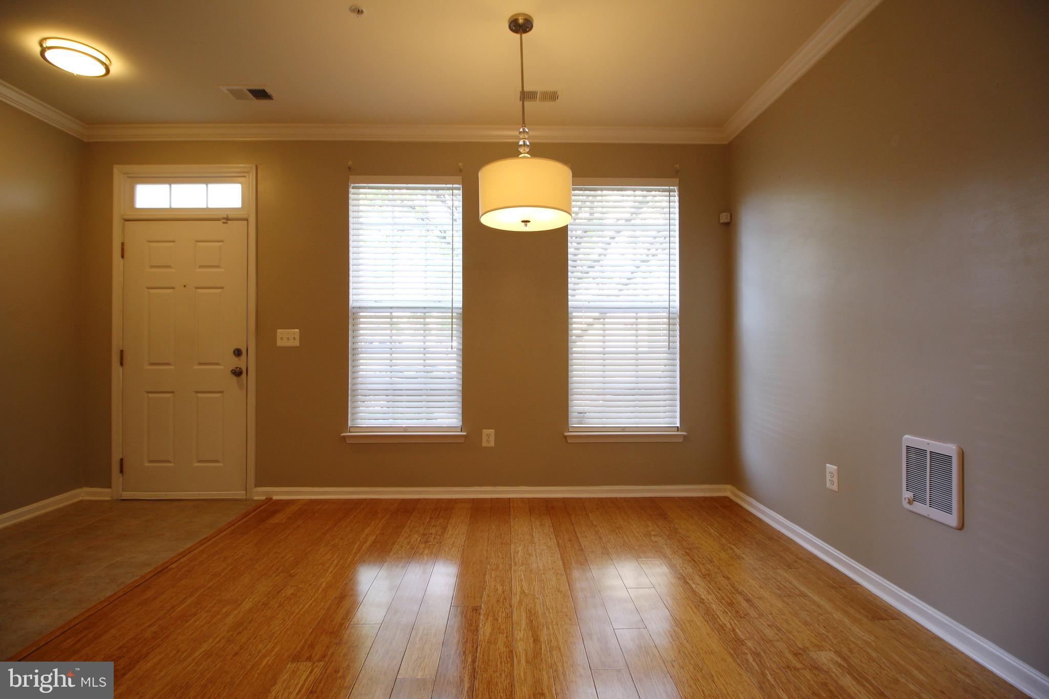 2415 Rainswood Lane Woodbridge, VA 22191 - Photo 26 of 29 a view of an empty room with wooden floor and a window