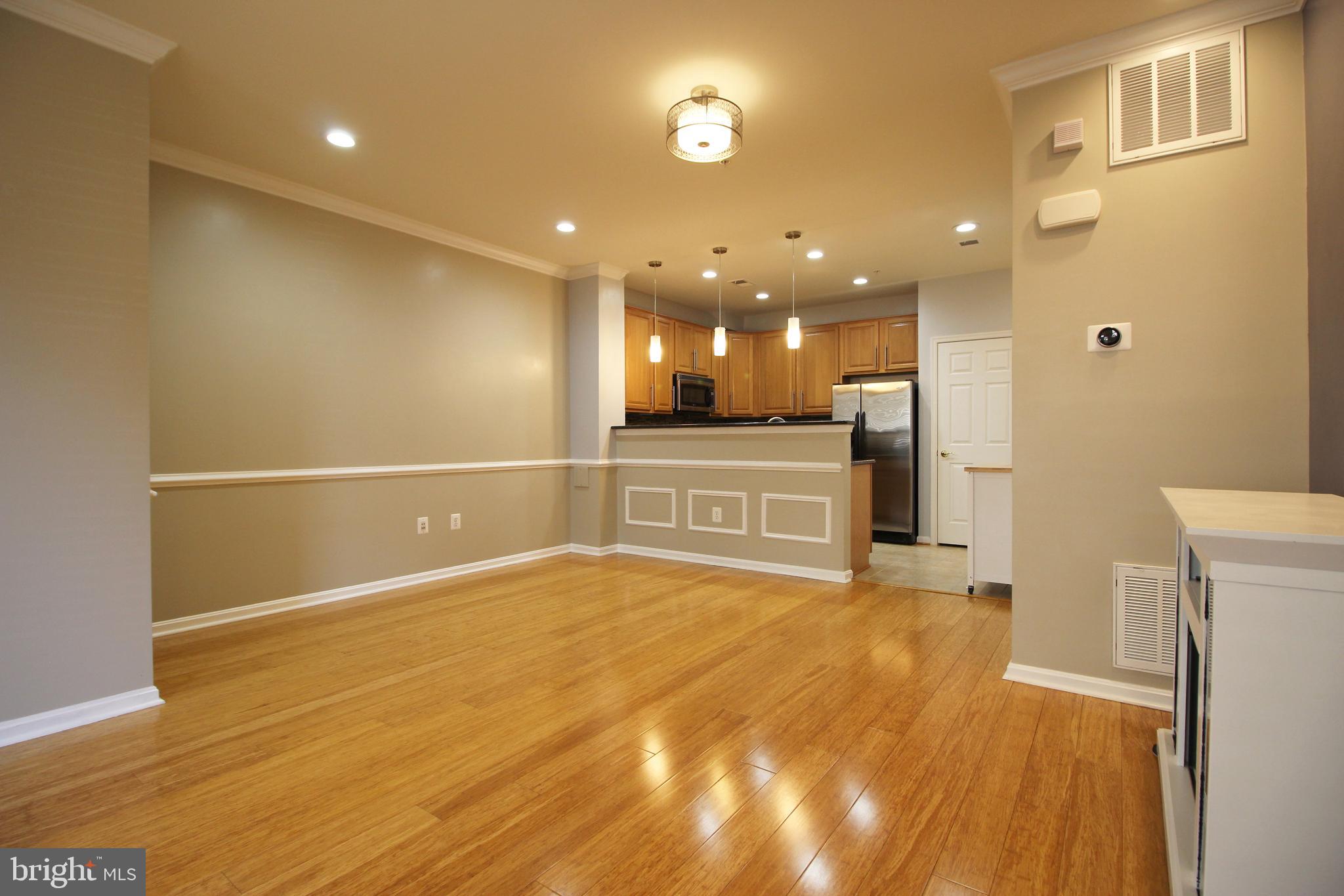 2415 Rainswood Lane Woodbridge, VA 22191 - Photo 5 of 29 a view of an empty room with kitchen and a window