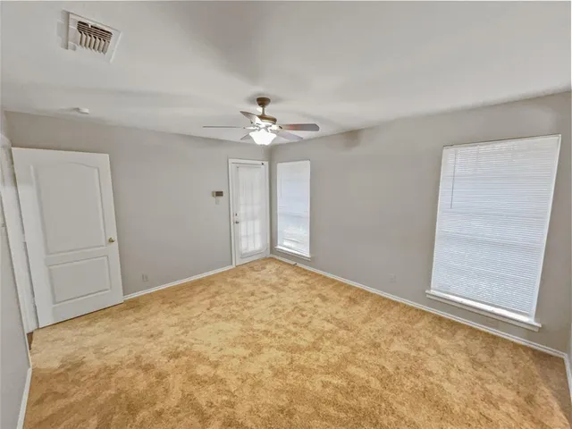 a bathroom with a tub sink a mirror and a bathtub