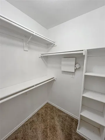 a view of an empty walk in closet