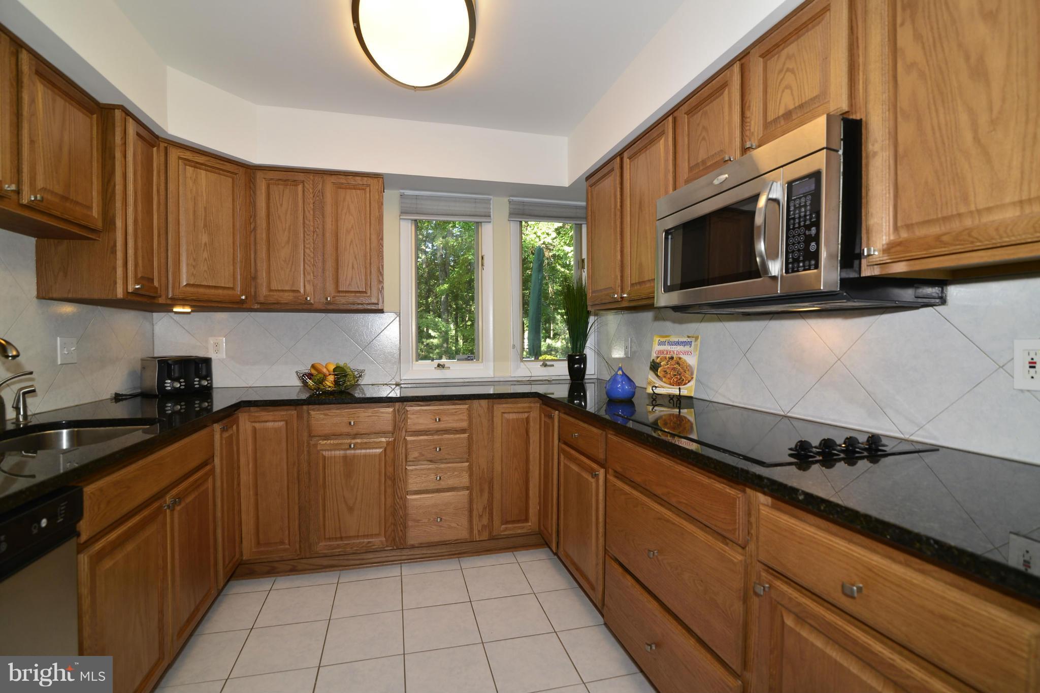 2446 Freetown Drive Reston, VA 20191 - Photo 4 of 30 Kitchen features granite, tile, SS appls