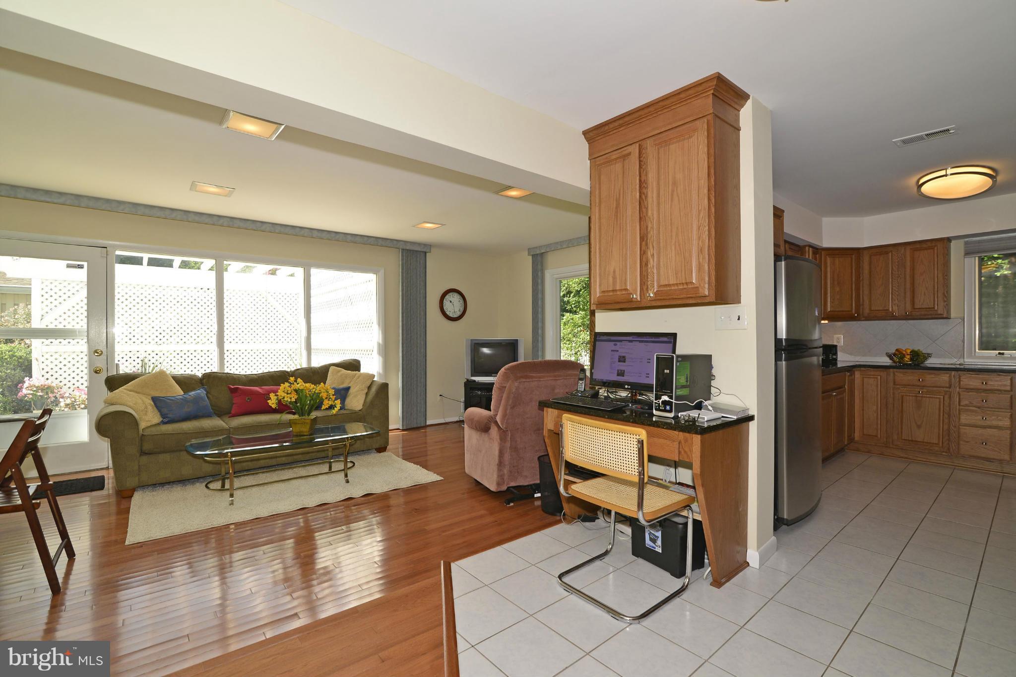 2446 Freetown Drive Reston, VA 20191 - Photo 7 of 30 Family Room w/ view to Kitchen