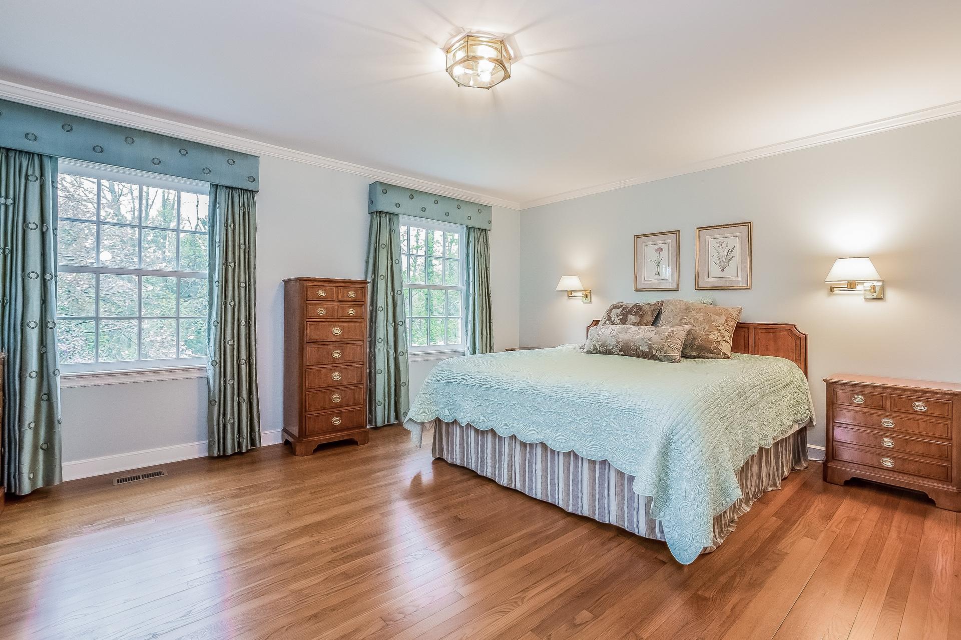 11 Pondfield Lane Darien, CT 06820 - Photo 13 of 31 a bedroom with a bed and a window