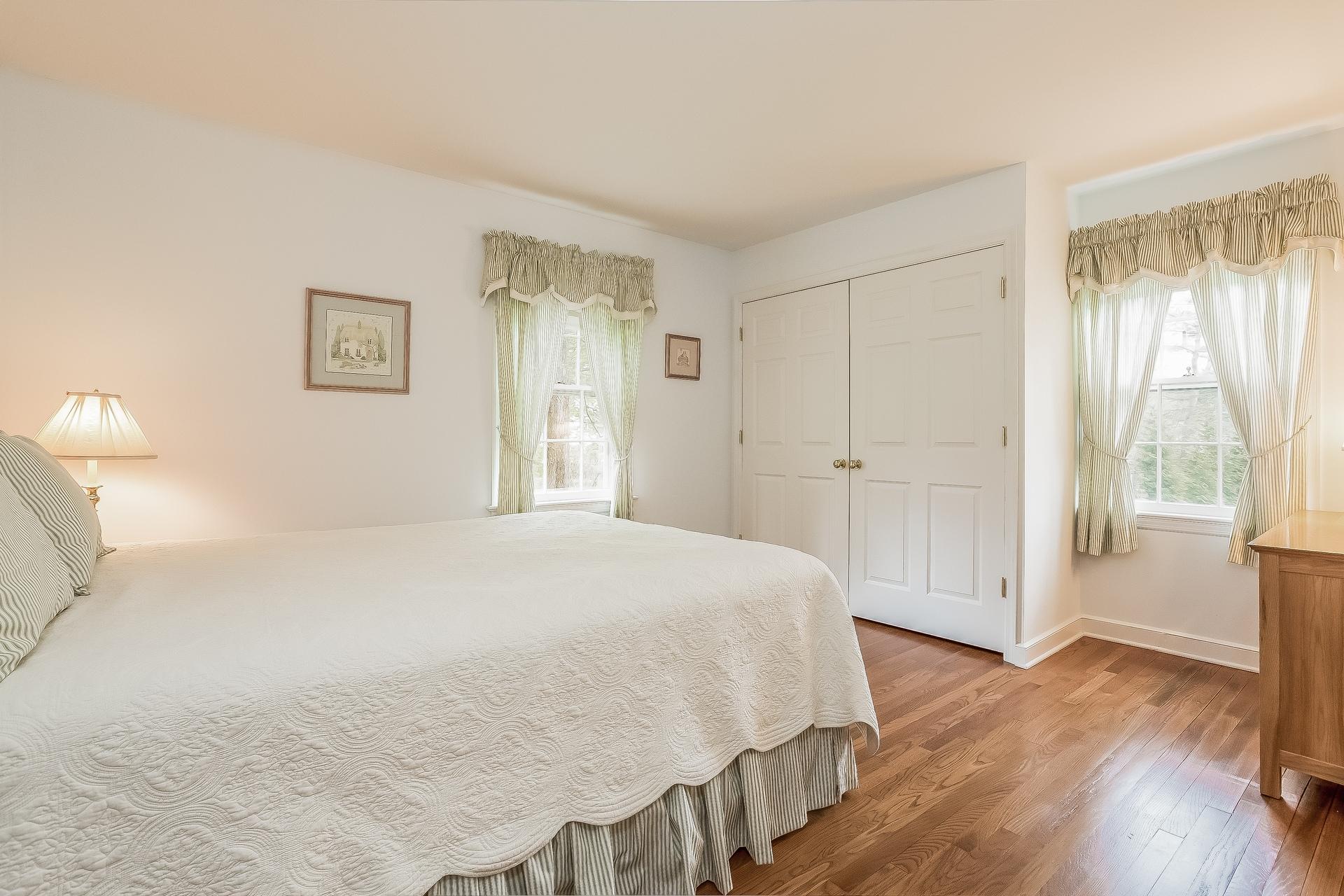 11 Pondfield Lane Darien, CT 06820 - Photo 16 of 31 a bedroom with a bed and a window