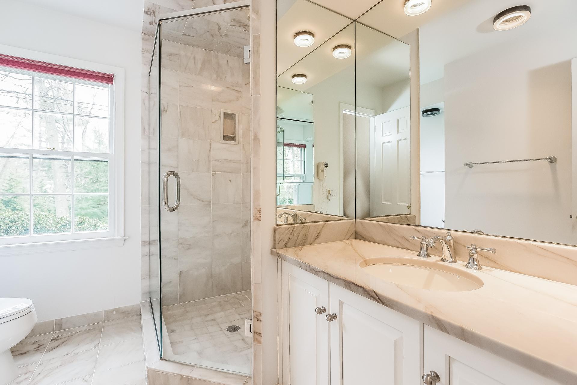 11 Pondfield Lane Darien, CT 06820 - Photo 17 of 31 a bathroom with a granite countertop sink toilet and shower