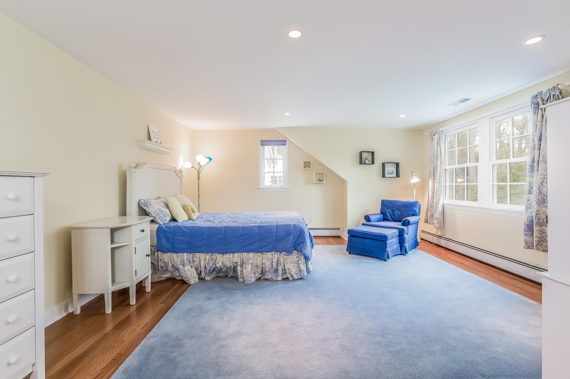 11 Pondfield Lane Darien, CT 06820 - Photo 18 of 31 a spacious bedroom with a bed and a window