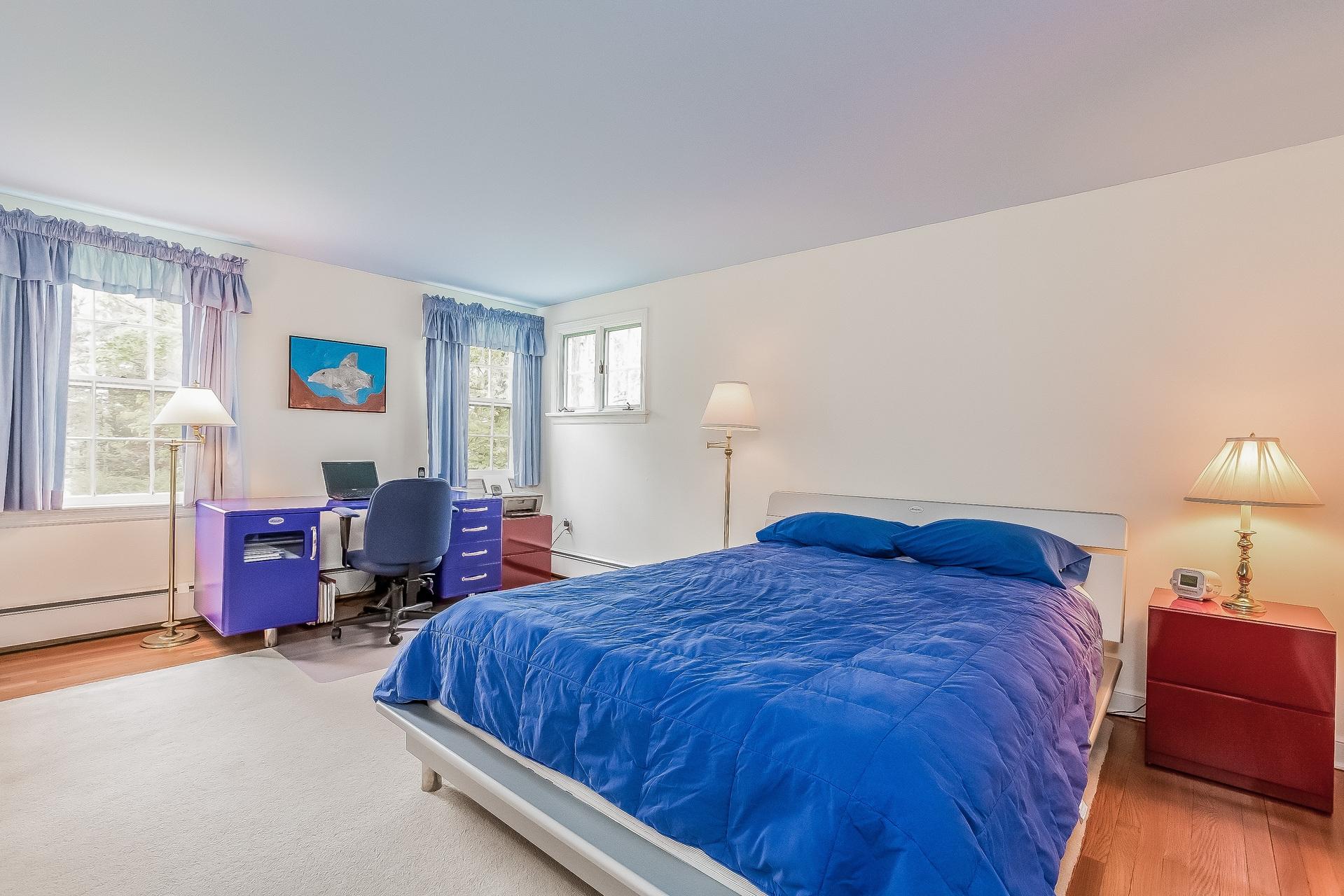 11 Pondfield Lane Darien, CT 06820 - Photo 19 of 31 a bed sitting in a bedroom next to a window