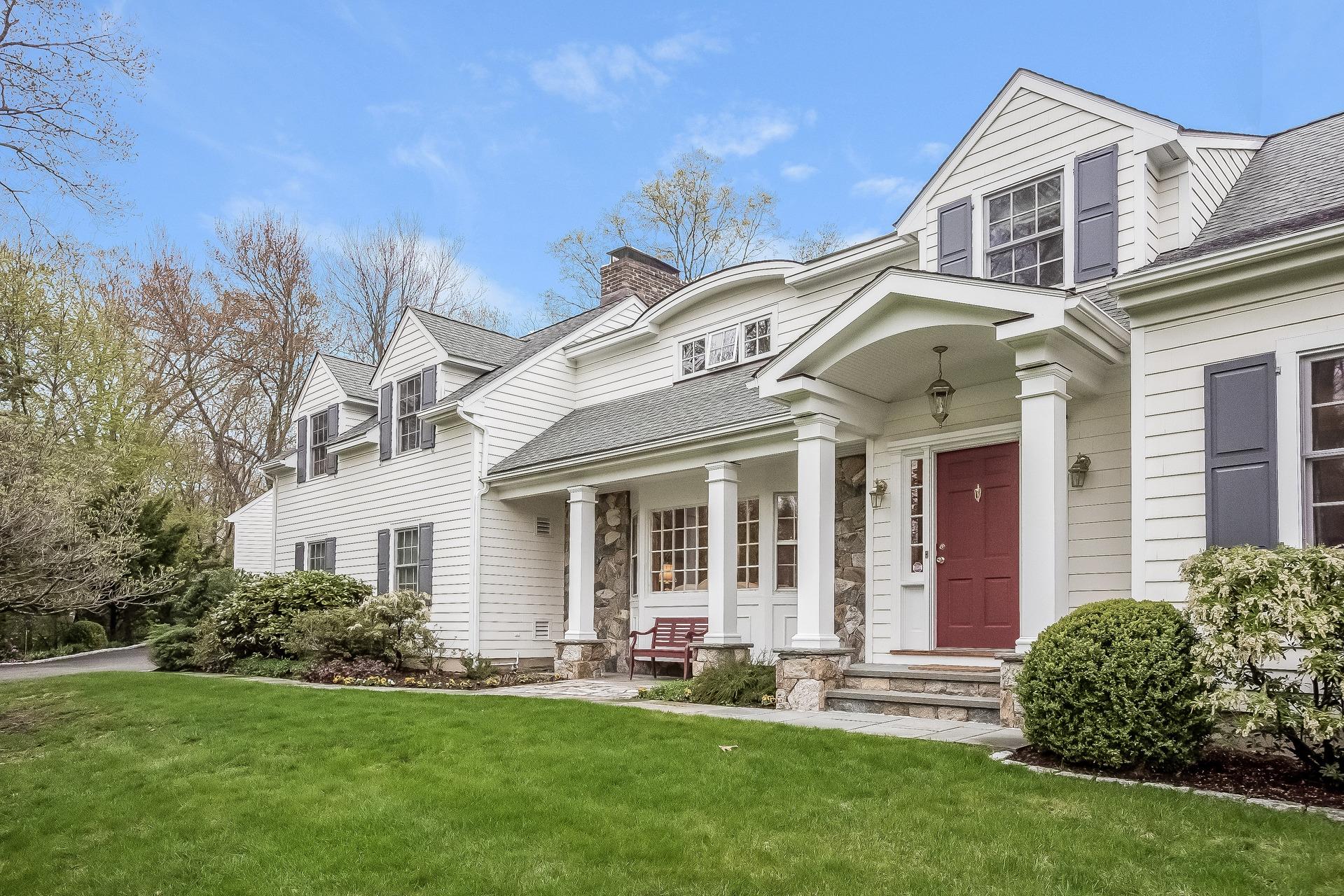 11 Pondfield Lane Darien, CT 06820 - Photo 2 of 31 a view of a house with a yard and plants